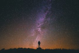 The Sanctity of Life (poem): person standing under starry night sky