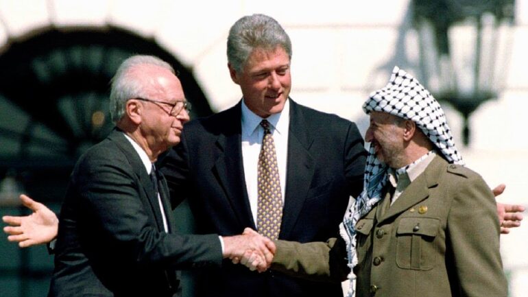 Bill Clinton, Yitzhak Rabin, and Yasser Arafat after the signing of the Oslo Accords