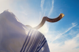 Jewish man blowing the Shofar for Rosh HaShanah