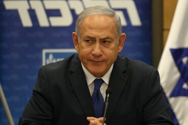 Prime Minister Binyamin Netanyahu at Likud faction meeting, determined to keep building Jewish communities in the West Bank despite international pressure