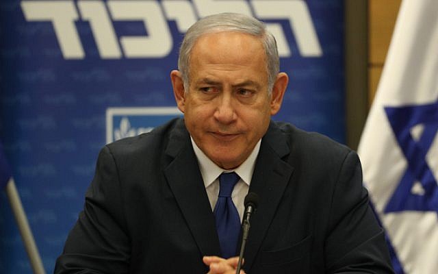 Prime Minister Binyamin Netanyahu at Likud faction meeting, determined to keep building Jewish communities in the West Bank despite international pressure