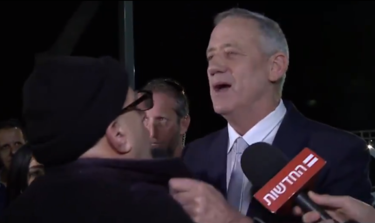 Benny Gantz putting hands on Elie Yosef
