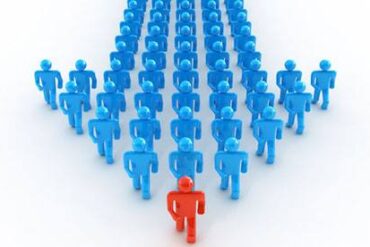 Parshat Vayaqhel - many blue figures walking after a red leader