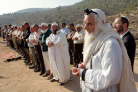 R MenaḥemFroman leading a joint prayer.jpg