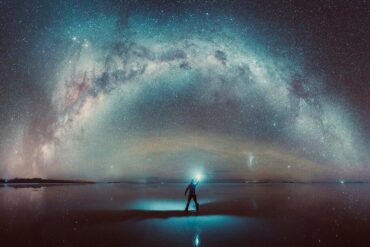Man standing under bright stars at night, "Objects in Mirror" by Yonah ben-Avraham